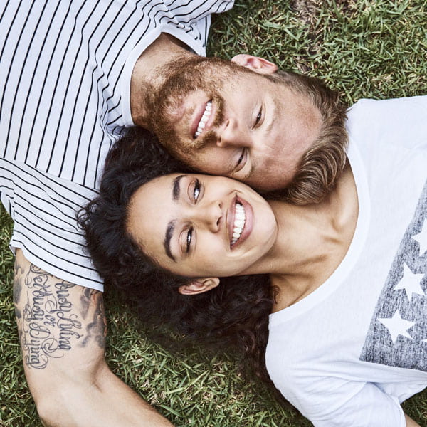 A smiling couple outdoors symbolizing happiness after dental treatments in Monroeville, PA