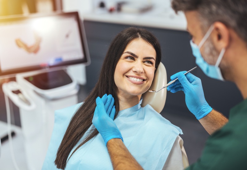 A patient smiling during composite bonding, showing budget-friendly smile improvement in Monroeville